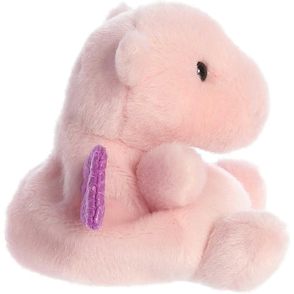 Side profile view of Aurora Palm Pals Aria Pink Dragon plush showing rounded snout and tail.