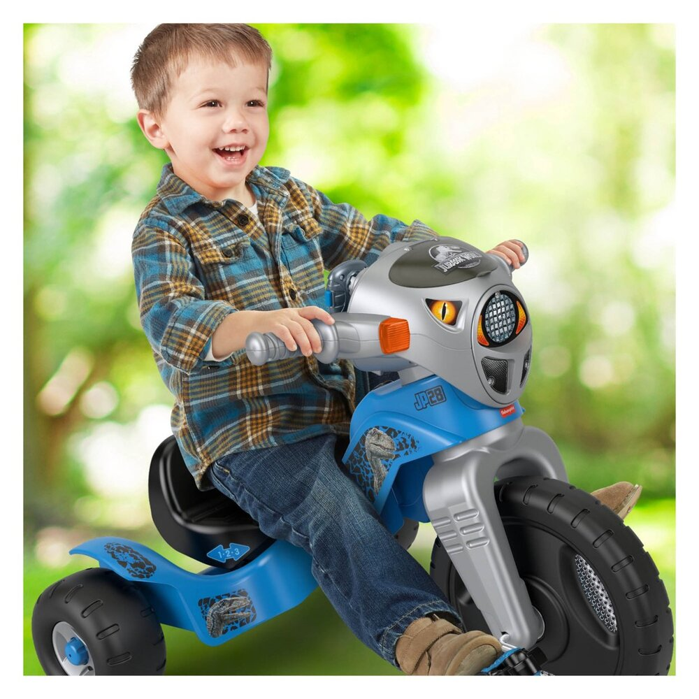 Fisher-Price Jurassic World Velociraptor Dinosaur Tricycle with Lights Sounds Walkie-Talkie and Storage Area