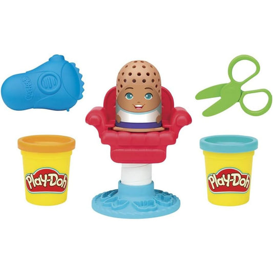 Layout thumbnail of the mini red and blue salon chair, character figure, green scissors, blue razor, and two yellow Play-Doh compound cans.