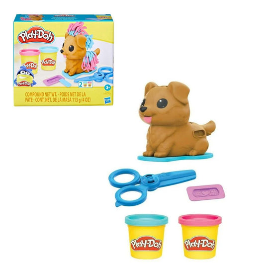 Play-Doh Mini Groom 'n Vet Set packaging box next to brown puppy extruder figure, blue plastic scissors, purple bandage stamp tool, and 2 Play-Doh compound cans.