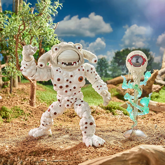 Action shot thumbnail of Eye Guy figure in a rocky landscape next to his floating eyeball energy blast.